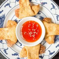 Crab Meat Rangoon (4) · 蟹角 4 Crab meat and cream cheese Rangoons served with sweet and sour sauce