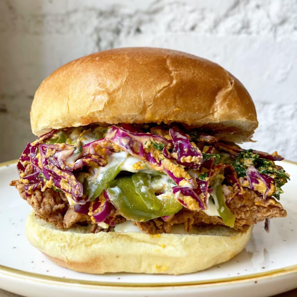 Spicy Ranch Sandwich · Crispy chicken, kale and cabbage slaw, buttermilk ranch, pickled jalapenos. Just Sandwich
