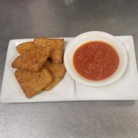 Fried Mozzarella Wedges · Chinese dumpling that comes with filling.