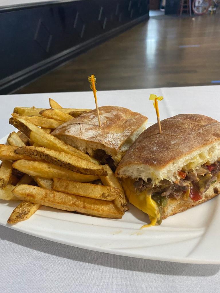 Philly Cheesesteak Sandwich · Classic sandwich with peppers and onions and cheese on hero