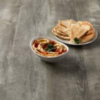 Hummus · Chickpea based dip served with pita bread.
