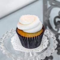 White Velvet Cupcake · Vanilla cake topped with cream cheese icing.