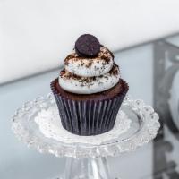 Oreo Cookie Cupcake · Dark devil cake with a double-stuffed Oreo baked inside; topped with a cream cheese icing an...