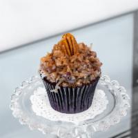 German Chocolate Cupcake · Milk chocolate cake topped with old fashion icing, coconuts and pecans.