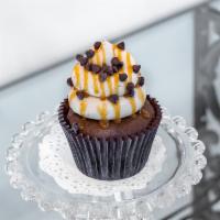 Choco-Nutter · Dark devil cake with chocolate ganache filling; topped with a peanut butter buttercream icin...