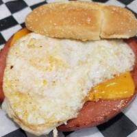 Southern Fried Love · Fried bologna sammy.  Bologna, cheddar cheese, runny egg and mayo served on a sesame bun.