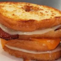 Bless Your Heart...This Ain't Your Mammas Grilled Cheese · Melted Cheddar and Provolone nestled between 2 Warm Glazed Donuts!