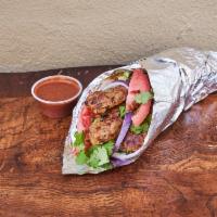 Kofta Kabab Gyro Sandwich · Cooked on a spit and wrapped in a pita.