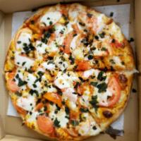 Margarita Pizza · Light tomato sauce, fresh mozzarella, basil, tomatoes drizzled with olive oil.