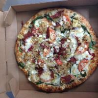 Spinach and Artichoke Pizza · Garlic herb sauce, mozzarella cheese, tomatoes, mushrooms, caramelized onions, baby spinach,...