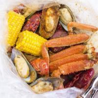 Make your own juicy seafood combo · Our boiling seafood taste better with you hands!!!seafood served with corn & potato 
