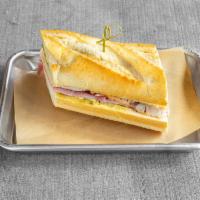 Cuban Panini · Ham, turkey, swiss cheese,pickles with  house sauce.