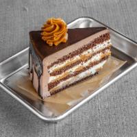 Ensueño Slice · Thin layers of moist chocolate cake filled with dulce de leche and homemade chantilly cream,...