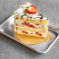 Strawberry Shortcake Slice  · Moist vanilla sponge cake filled with chantilly cream and fresh strawberries.