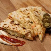 Philly Cheese Quesadilla  · Philly steak, mozzarella cheese and grilled onions. Served with sour cream and salsa in your...