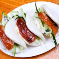 4 Piece Peking Roasted Duck Buns 北京鸭（4片） · Freshly steamed buns with Spring onions and shredded cucumber slices.