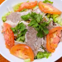Grilled Pork Salad 烤猪肉片沙拉 · Fresh daikon radish, carrots, iceberg lettuce, cucumber, tomatoes, mint leaves, and red onio...