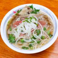 Pho Xe Lua #1 火车头牛肉粉 · Rare thin beef, brisket beef, tripe, and tendon. Rice noodle beef soup base. Served with bas...