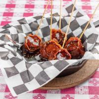 Lollipops (GF) · Bite sized sausage wrapped in bacon on a skewer dipped in honey BBQ sauce 