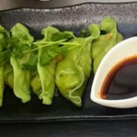 Veggie Dumpling  · Served with sweet soy vinaigrette. Steamed or fried. Vegeterian .