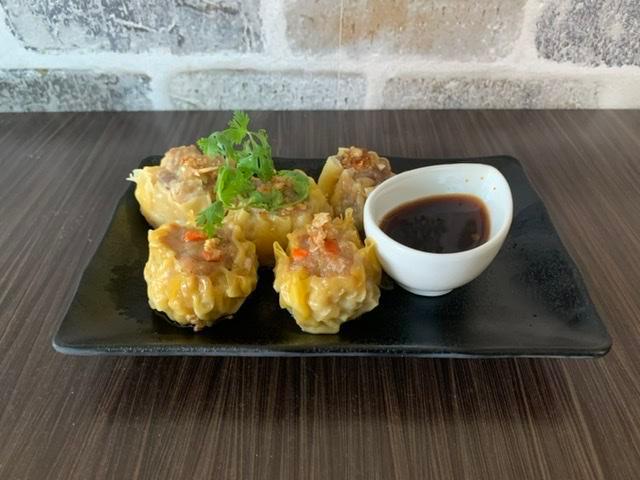 Thai Shrimp and Chicken Dumpling · Steamed of fried minced chicken and shrimp with mushroom, water chestnuts wrapped in wonton skin served with sweet soy vinaigrette dipping sauces.