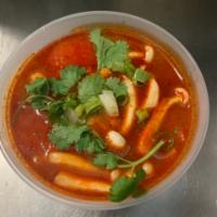 Tom Yum Soup  · Spicy and sour soup seasoned with tomato, mushroom, scallions, onions, lemongrass and kaffir...