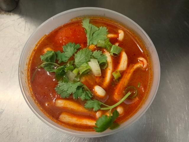 Tom Yum Soup  · Spicy and sour soup seasoned with tomato, mushroom, scallions, onions, lemongrass and kaffir lime leaves. Spicy.