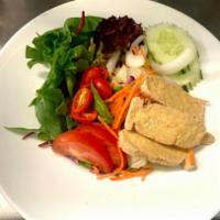 Thai Salad · A variety of fresh garden greens with tomatoes, onion, carrots, cucumbers and fried tofu. Se...