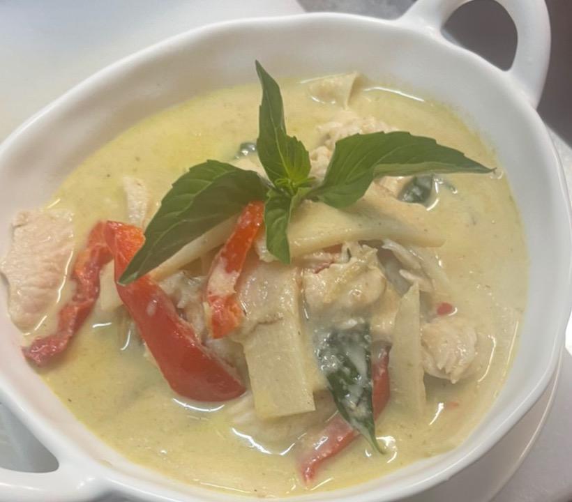Green Curry · Green chili paste with eggplants, bamboo shoot, fresh basil and bell peppers simmered in coconut milk. Spicy.