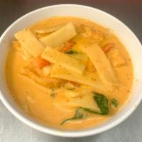 Red Curry  · Red curry paste with bamboo shoot, fresh basil and bell peppers simmered in coconut milk. Sp...