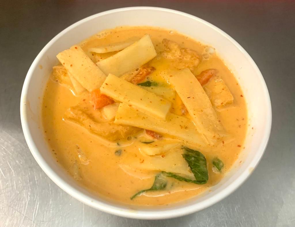 Red Curry  · Red curry paste with bamboo shoot, fresh basil and bell peppers simmered in coconut milk. Spicy.