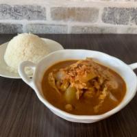 Massaman Curry  · Mild curry with potatoes, onions, carrots and peanut simmered in coconut milk.