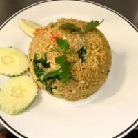 Yellow Fried Rice · Stir fried rice with curry powder, carrot, scallions, onion and egg.