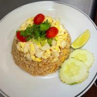 Crab Meat Fried Rice · Stir fried rice with lump crab meat, egg. Served with chili fish sauce on the side.