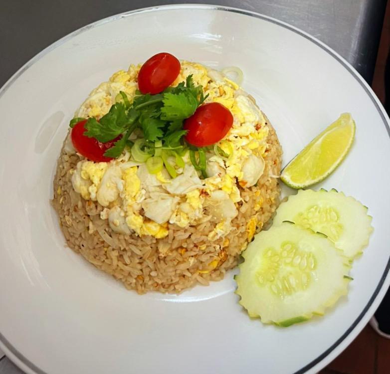 Crab Meat Fried Rice · Stir fried rice with lump crab meat, egg. Served with chili fish sauce on the side.