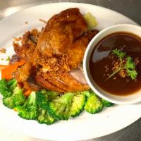 Duck Tamarind · Crispy 1/2 duck served with tamarind sauce and steamed veggies.
