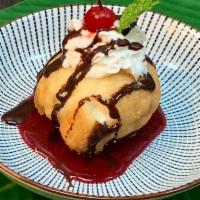 Fried Ice Cream · Served with chococlate and raspberry sauce.