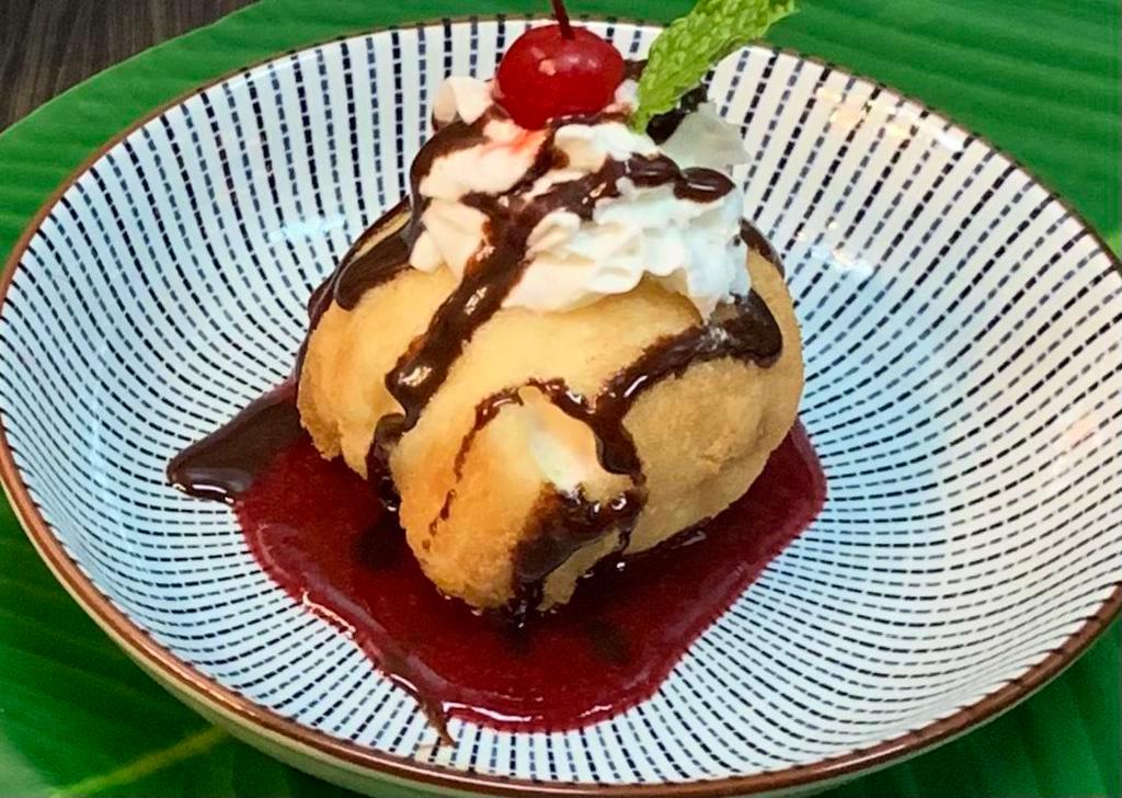 Fried Ice Cream · Served with chococlate and raspberry sauce.