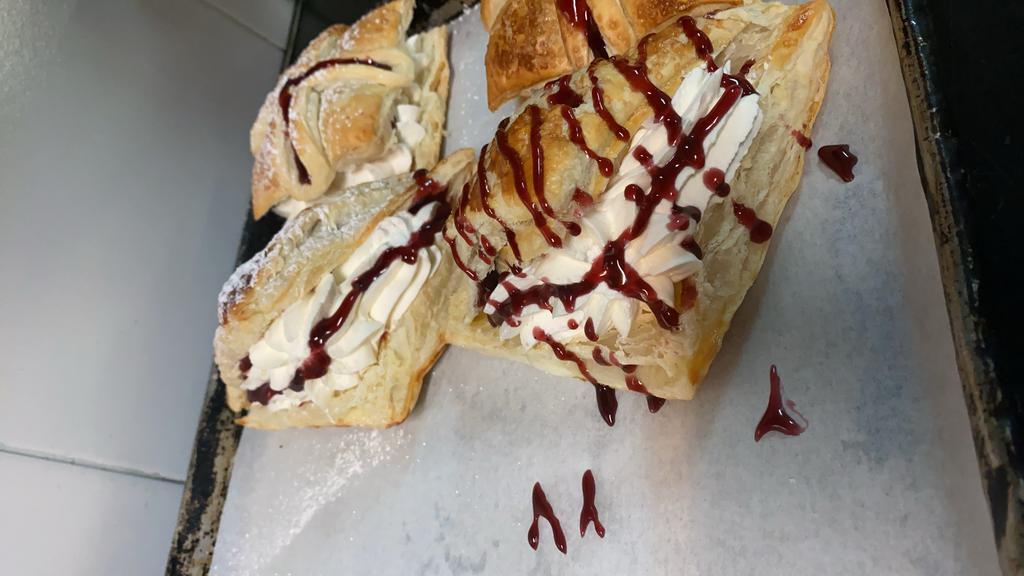 Raspberry Fresh Cream Turnover · Fresh cream and raspberry sauce in a puff pastry turnover