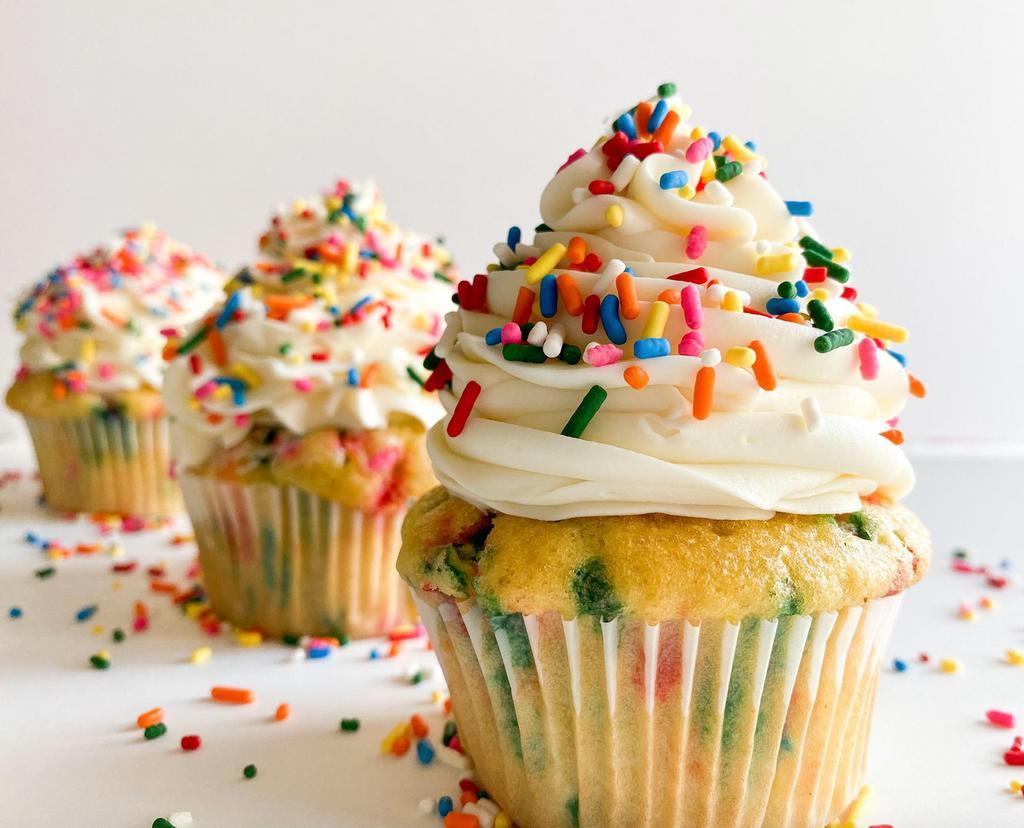 Party Time · A fluffy moist vanilla and sprinkle based cupcake accompanied by a whipped vanilla buttercream  frosting,  topped with a fun helping of rainbow sprinkles 