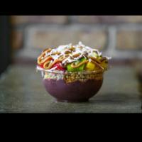 Frutta Bowl · Organic acai and banana bases topped with granola, strawberries, pineapple, kiwi, Nutella, p...