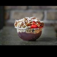 Frutella Bowl · Organic acai and banana bases topped with granola, banana, strawberries, Nutella, peanut but...