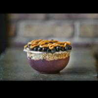 PB and J Bowl · Organic acai and banana topped with granola, blueberries, and peanut butter.