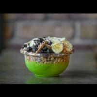 Caveman Bowl · Kale, banana, pineapple, and almond milk topped with granola, banana, blueberries, almond bu...