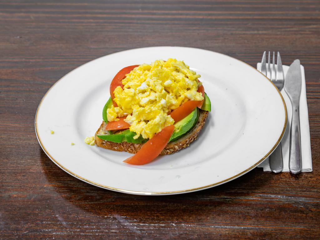 Mini Avocado Toast · Avocado and tomato slices with eggs served on 9 grain bread.