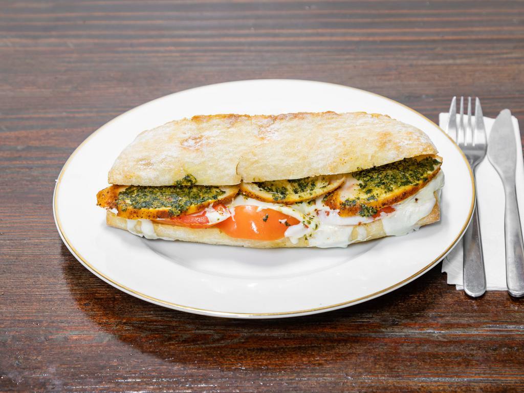 Grilled chicken sandwich · Grilled chicken breast with pesto and melted mozzarella and tomato 