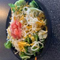 Side Salad · Iceberg, green leaf lettuces, mozzarella, cheddar, tomatoes and Parmesan.