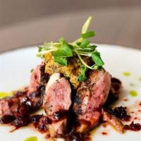 Magret de Pato Plate · Duck magret over a tower of sweet plantain a d zinfandel goat cheese.