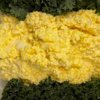Creamy Egg Salad platter · Chopped eggs that have been mixed with seasoning and mayo.
with a side Roll, slice of bread ...