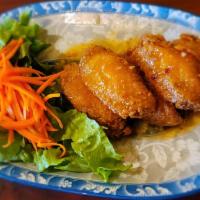 4. Viet Wings · Crispy chicken wings tossed in lime, fish sauce, and garlic dressing.